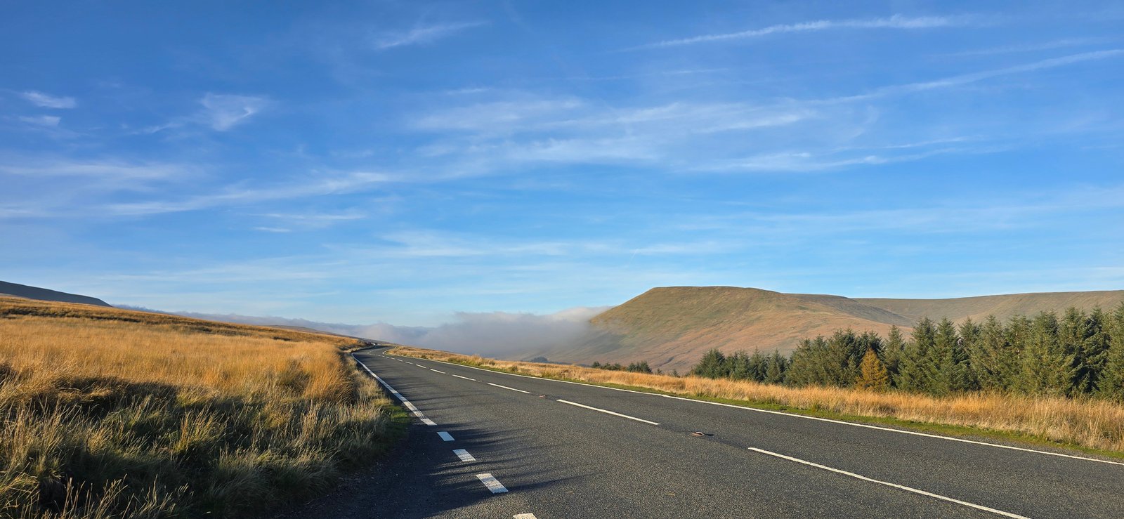 Open road leading through a mountain pass